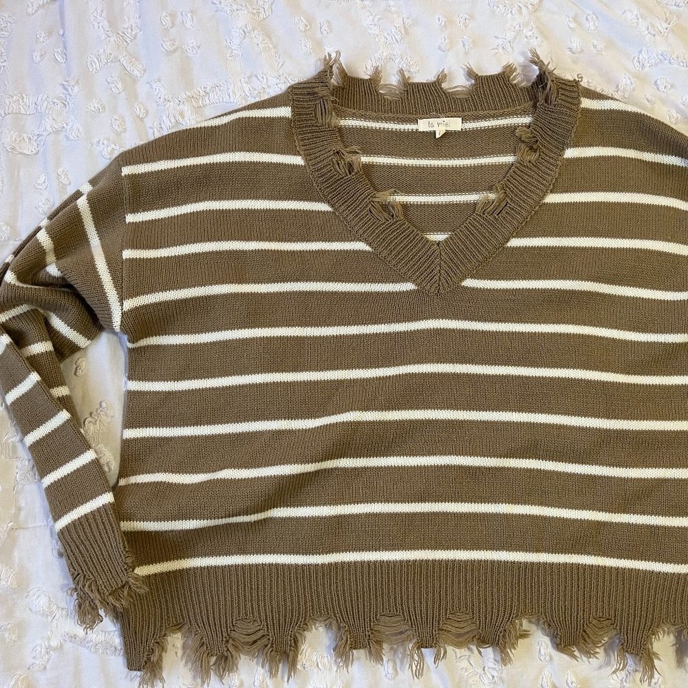 Frayed tan striped sweater. Super cozy and comfy! Worn twice